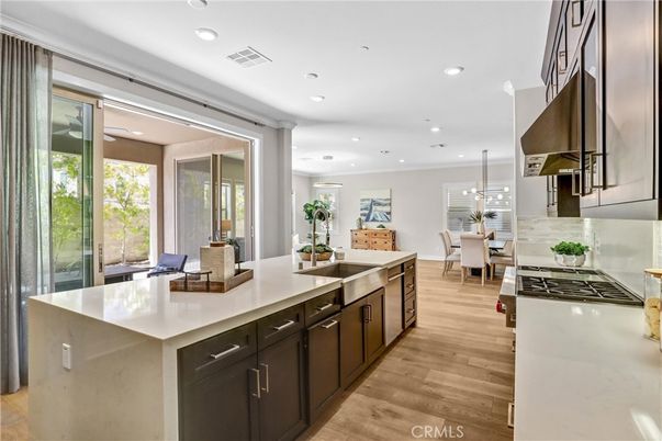 Dining room, Interior, Kitchen, Pendant Lights, Recessed Lighting, Stainless Steel Appliances, Wood Texture Flooring