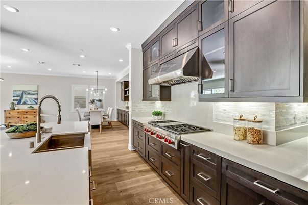 Chandelier, Dining room, Interior, Kitchen, Pendant Lights, Recessed Lighting, Stainless Steel Appliances, Wood Texture Flooring
