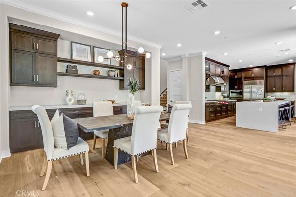 Dining room, Interior, Kitchen, Pendant Lights, Recessed Lighting, Stainless Steel Appliances, Wood Texture Flooring