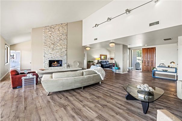 Fireplace, Interior, Living room, Recessed Lighting, Stone Walls, Wood Texture Flooring