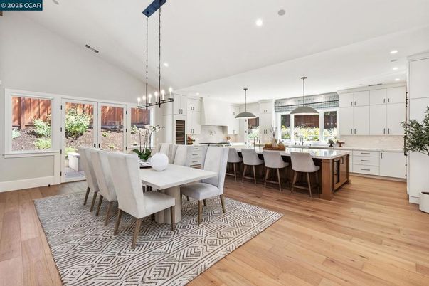 Dining room, Interior, Kitchen, Pendant Lights, Recessed Lighting, Stainless Steel Appliances, Wood Texture Flooring