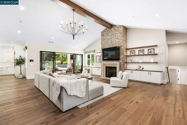 Fireplace, Interior, Living room, Pendant Lights, Recessed Lighting, Stone Walls, Wooden Beams, Wood Texture Flooring