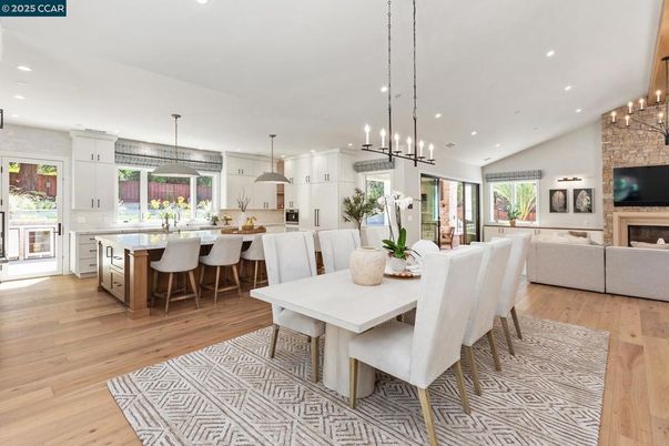 Dining room, Fireplace, Interior, Kitchen, Living room, Pendant Lights, Recessed Lighting, Stainless Steel Appliances, Stone Walls, Wood Texture Flooring