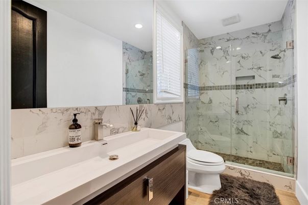 Bathroom, Glass Shower, Interior, Marble Walls, Recessed Lighting, Wood Texture Flooring
