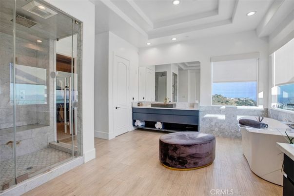 Bathroom, Free Standing Baths, Glass Shower, Interior, Recessed Lighting, Wood Texture Flooring