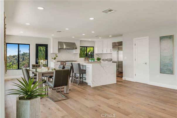 Dining room, Interior, Kitchen, Marble Walls, Recessed Lighting, Stainless Steel Appliances, Wood Texture Flooring