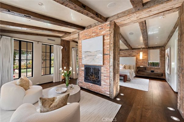 Bedroom, Fireplace, Interior, Living room, Recessed Lighting, Stone Walls, Wooden Beams, Wood Texture Flooring