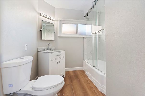 Bathroom, Glass Shower, Interior, Marble Walls, Wood Texture Flooring