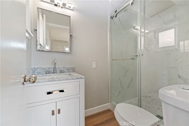 Bathroom, Glass Shower, Interior, Marble Walls, Wood Texture Flooring