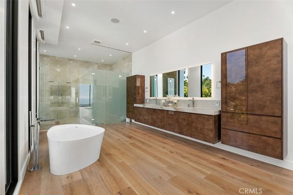Bathroom, Dual Sink Vanities, Free Standing Baths, Glass Shower, Interior, Recessed Lighting, Wood Texture Flooring