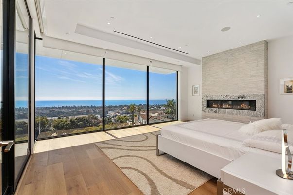 Bedroom, Fireplace, Interior, Recessed Lighting, Water, Wood Texture Flooring