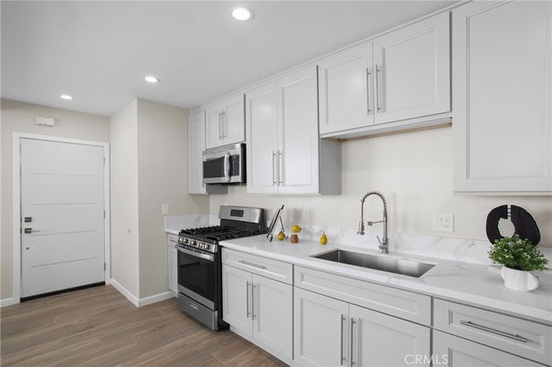 Interior, Kitchen, Recessed Lighting, Stainless Steel Appliances, Wood Texture Flooring