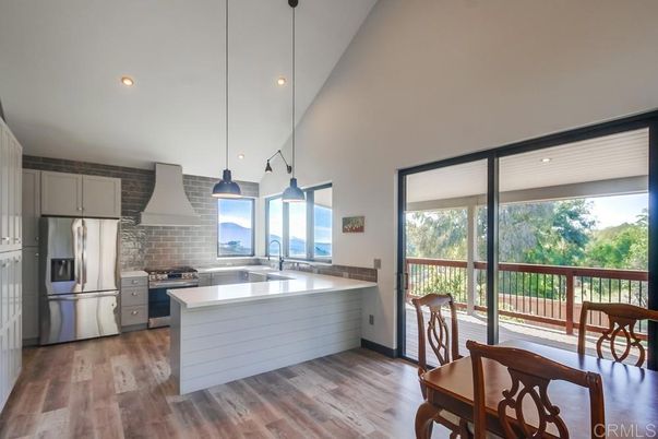 Interior, Kitchen, Pendant Lights, Recessed Lighting, Stainless Steel Appliances, Stone Walls, Wood Texture Flooring