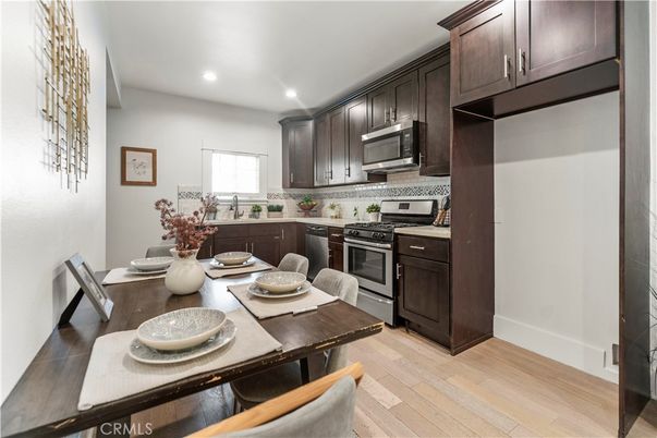 Dining room, Interior, Kitchen, Recessed Lighting, Stainless Steel Appliances, Wood Texture Flooring