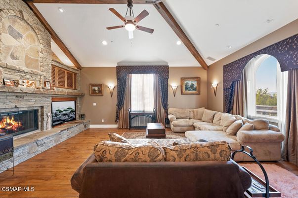 Fireplace, Interior, Living room, Recessed Lighting, Stone Walls, Wooden Beams, Wood Texture Flooring