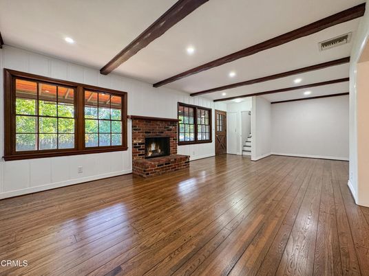 Empty room, Fireplace, Interior, Recessed Lighting, Stone Walls, Wooden Beams, Wood Texture Flooring