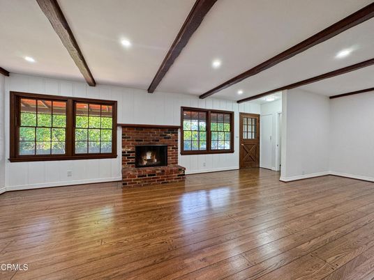 Empty room, Fireplace, Interior, Recessed Lighting, Stone Walls, Wooden Beams, Wood Texture Flooring