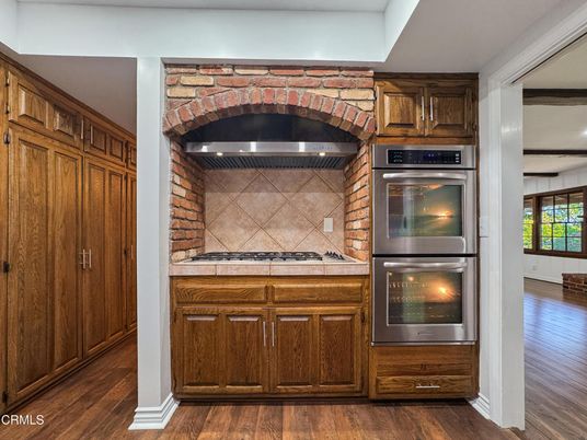 Interior, Kitchen, Stainless Steel Appliances, Tile Countertops, Wood Texture Flooring