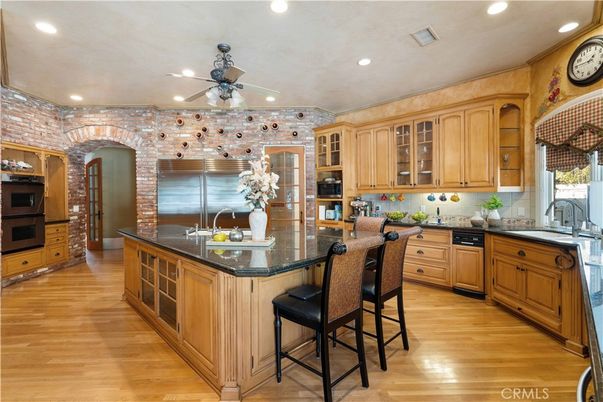 Interior, Kitchen, Recessed Lighting, Stainless Steel Appliances, Stone Walls, Wood Texture Flooring