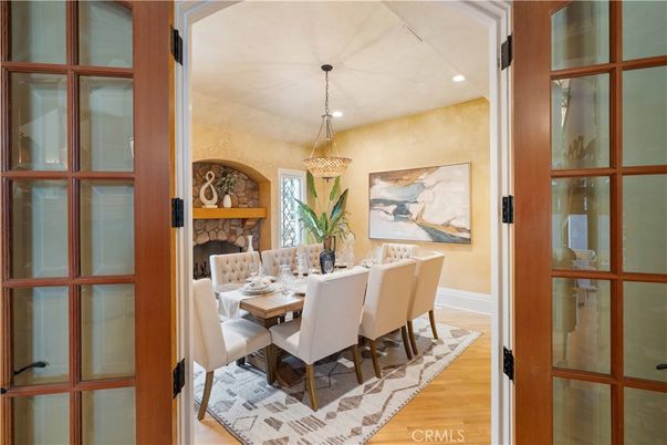 Chandelier, Dining room, Fireplace, Interior, Recessed Lighting, Stone Walls, Wood Texture Flooring
