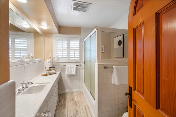 Bathroom, Dual Sink Vanities, Glass Shower, Interior, Wood Texture Flooring