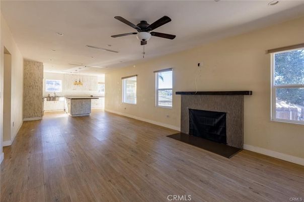 Empty room, Fireplace, Interior, Kitchen, Pendant Lights, Recessed Lighting, Wood Texture Flooring