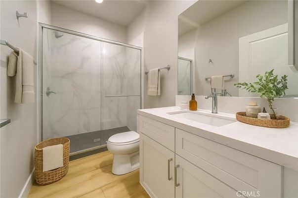 Bathroom, Glass Shower, Interior, Marble Walls, Recessed Lighting, Wood Texture Flooring
