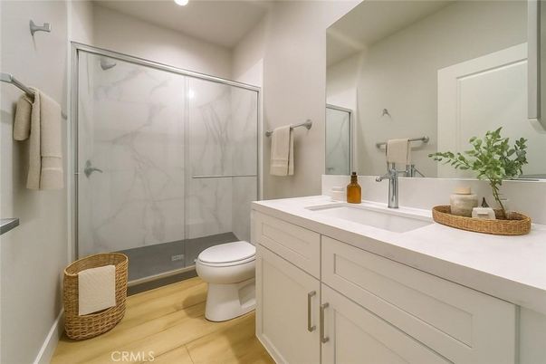 Bathroom, Glass Shower, Interior, Marble Walls, Recessed Lighting, Wood Texture Flooring