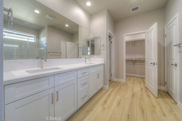 Bathroom, Dual Sink Vanities, Interior, Recessed Lighting, Walk-in Closets, Wood Texture Flooring