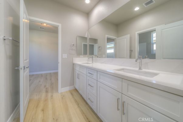Bathroom, Dual Sink Vanities, Interior, Recessed Lighting, Wood Texture Flooring