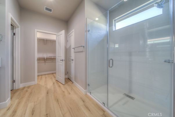 Bathroom, Glass Shower, Interior, Recessed Lighting, Walk-in Closets, Wood Texture Flooring