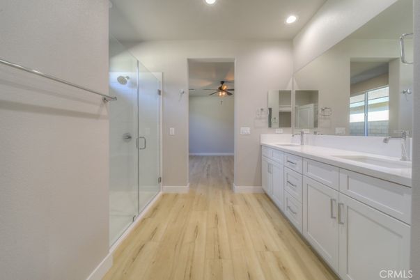 Bathroom, Dual Sink Vanities, Glass Shower, Interior, Recessed Lighting, Wood Texture Flooring