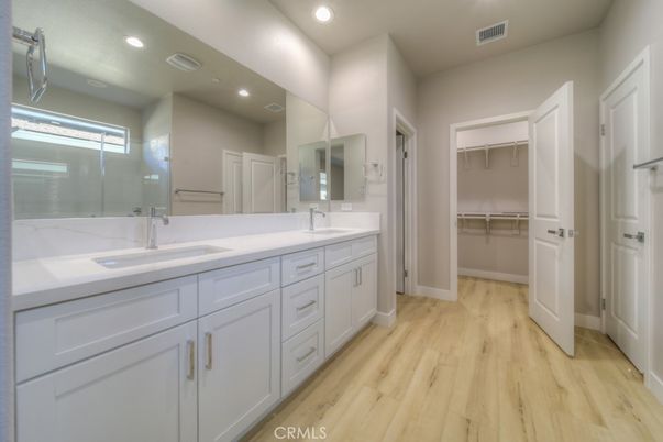 Bathroom, Dual Sink Vanities, Interior, Recessed Lighting, Walk-in Closets, Wood Texture Flooring