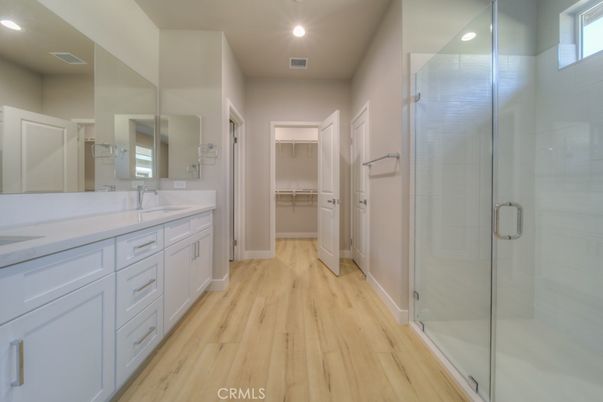 Bathroom, Dual Sink Vanities, Glass Shower, Interior, Recessed Lighting, Walk-in Closets, Wood Texture Flooring