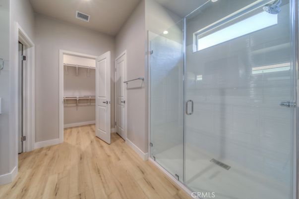 Bathroom, Glass Shower, Interior, Recessed Lighting, Walk-in Closets, Wood Texture Flooring