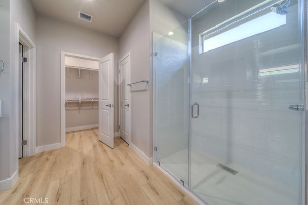 Bathroom, Glass Shower, Interior, Recessed Lighting, Walk-in Closets, Wood Texture Flooring