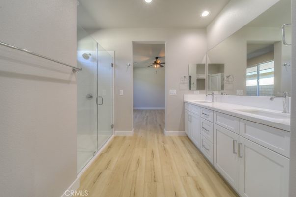 Bathroom, Dual Sink Vanities, Glass Shower, Interior, Recessed Lighting, Wood Texture Flooring
