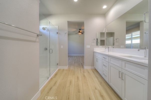 Bathroom, Dual Sink Vanities, Glass Shower, Interior, Recessed Lighting, Wood Texture Flooring