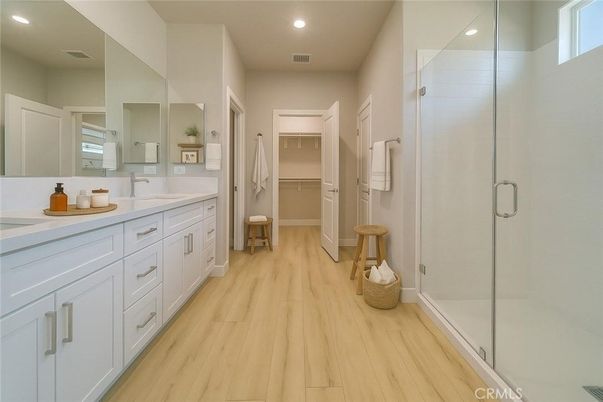 Bathroom, Dual Sink Vanities, Glass Shower, Interior, Recessed Lighting, Walk-in Closets, Wood Texture Flooring