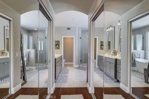 Bathroom, Dual Sink Vanities, Free Standing Baths, Glass Shower, Interior, Recessed Lighting, Wood Texture Flooring