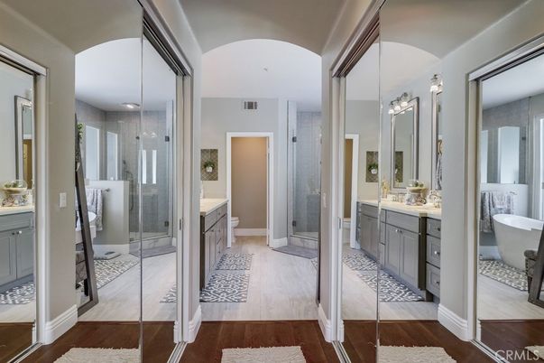 Bathroom, Dual Sink Vanities, Free Standing Baths, Glass Shower, Interior, Recessed Lighting, Wood Texture Flooring