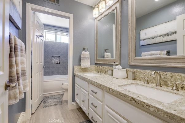 Bathroom, Dual Sink Vanities, Interior, Recessed Lighting, Wood Texture Flooring