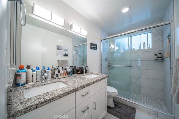 Bathroom, Dual Sink Vanities, Glass Shower, Interior, Marble Walls, Recessed Lighting