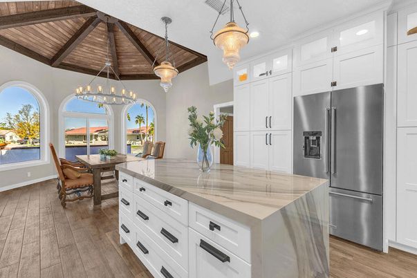 Chandelier, Dining room, Interior, Kitchen, Pendant Lights, Stainless Steel Appliances, Wooden Beams, Wooden Ceilings, Wood Texture Flooring