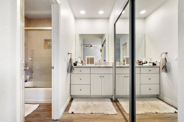 Bathroom, Dual Sink Vanities, Glass Shower, Interior, Recessed Lighting, Wood Texture Flooring