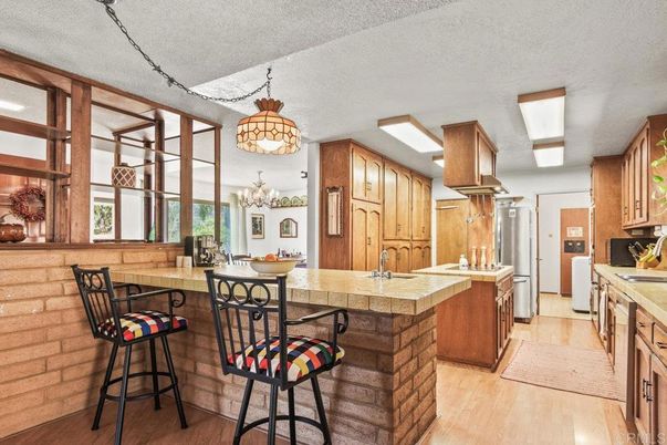 Chandelier, Interior, Kitchen, Tile Countertops, Wood Texture Flooring