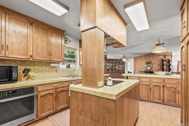 Interior, Kitchen, Stone Walls, Tile Countertops, Wood Texture Flooring