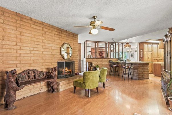Chandelier, Dining room, Fireplace, Interior, Kitchen, Living room, Stone Walls, Wood Texture Flooring