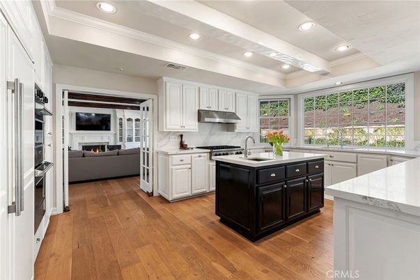 Fireplace, Interior, Kitchen, Living room, Recessed Lighting, Stainless Steel Appliances, Wood Texture Flooring