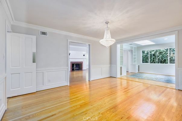 Chandelier, Empty room, Fireplace, Interior, Recessed Lighting, Wood Texture Flooring